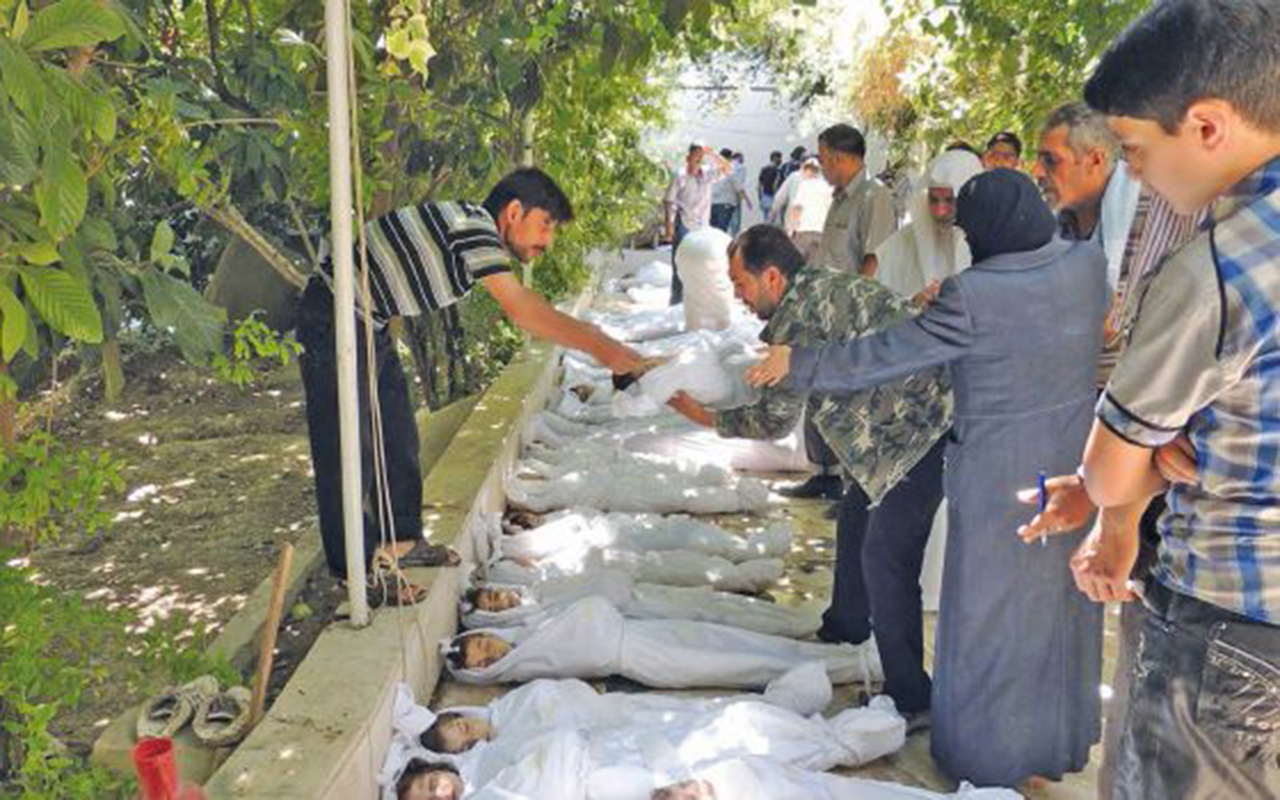 أطفال ضحايا مجزرة الغوطة (AFP)