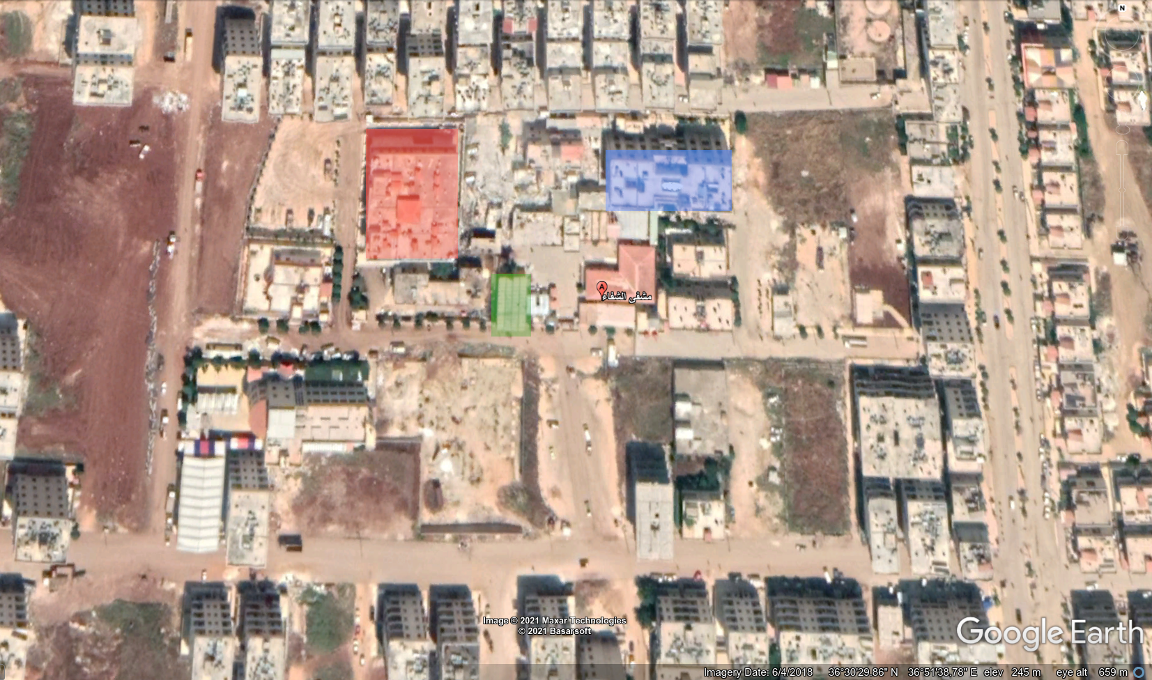 خريطة من غوغل إيرث تظهر مواقع الشرطة المدنية (بالأحمر) وفرع الأمن السياسي (بالأخضر) ومحكمة عفرين (بالأزرق) بالقرب من مشفى الشفاء المحدّد بالعلامة الحمراء